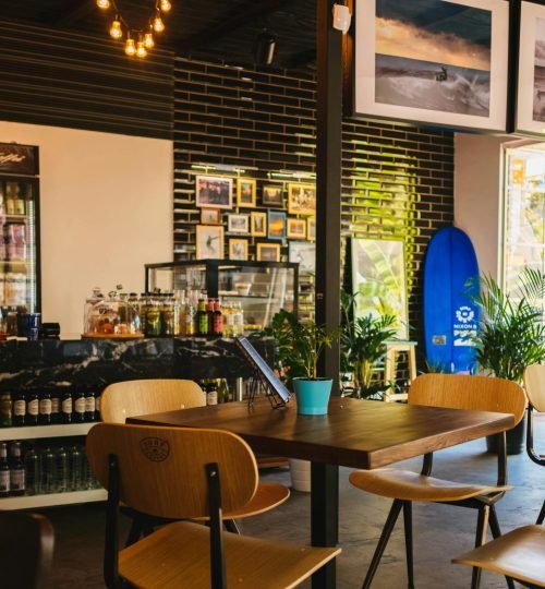 Stylish café interior with modern decor and natural lighting, located in Sochi, Russia.